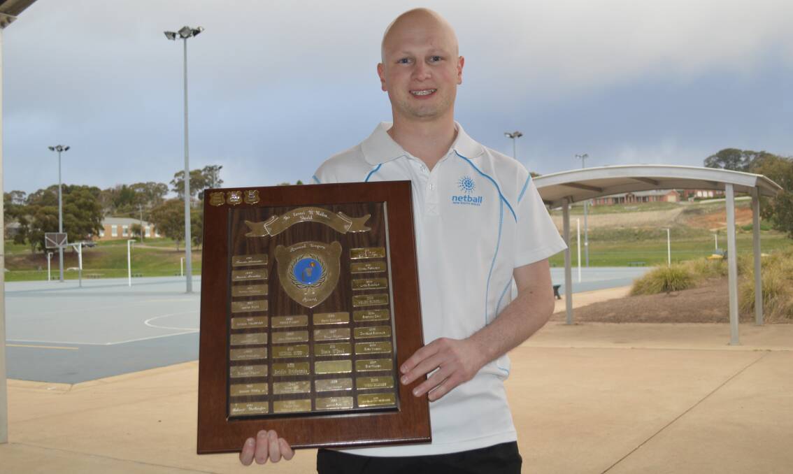 NATIONAL HONOUR: ONA's 2018 umpire of the year Michael Rudd, pictured showing off that shield, was awarded his A Badge recently. Photo: MATT FINDLAY