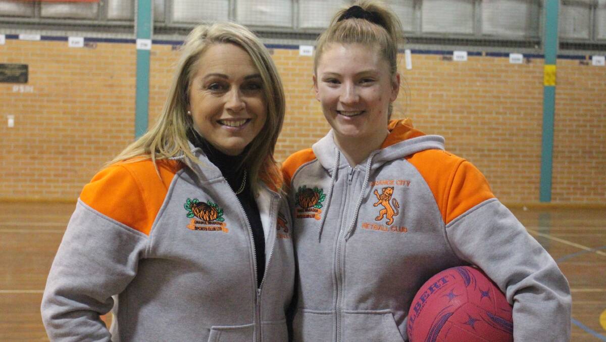 LION'S NEW LIFE: Orange City coach Cindy Gilchrist with Brooke Burcher, the latter will face her old side in this weekend's grand final. Photo: MAX STAINKAMPH