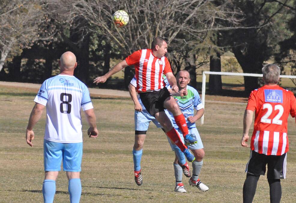 HANG TIME:  Barnstoneworth striker Wes Miller goes high in Sunday’s over 35s clash with Galddy-A-Tahs. Photo: CONTRIBUTED
