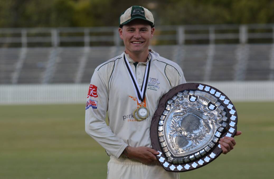 THE SKIPPER: Premiership-winning Orange City captain and player-of-the-final Ed Morrish shows off his spoils form last weekend's decider. Photo: MATT FINDLAY