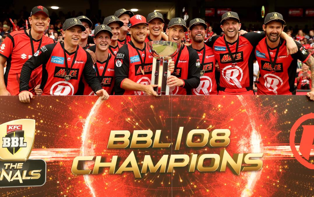 MAIDEN WIN: Chris Tremain (middle back) and his Melbourne Renegades teammates celebrate their incredible, comeback win on Sunday. AAP/MARK DADSWELL