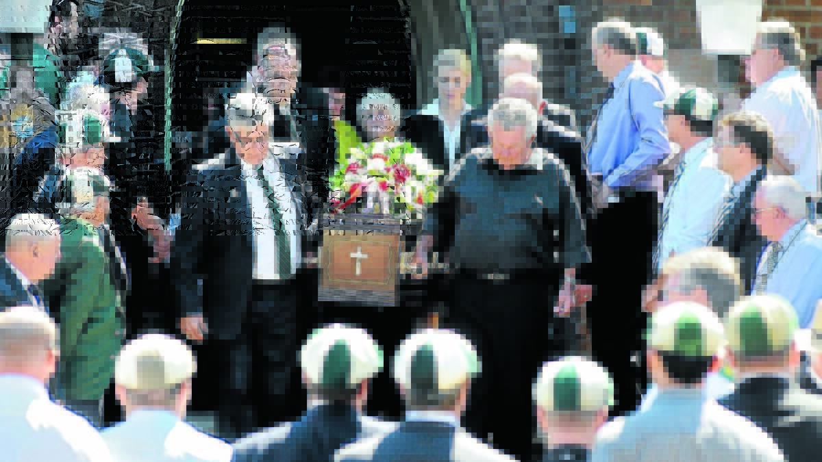 THE GREATEST INNINGS: An estimated 2,000 mourners gathered to bid farewell to Carl Sharpe, a legend of the sporting community in Orange and the Central West, in March of 2016. Photo: STEVE GOSCH