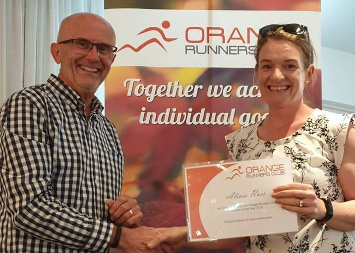 THE BEST: Orange Runners Club vice president Greg Shapter presents Alicia Ross with the runner of the year award at last weekend's presentation night.
