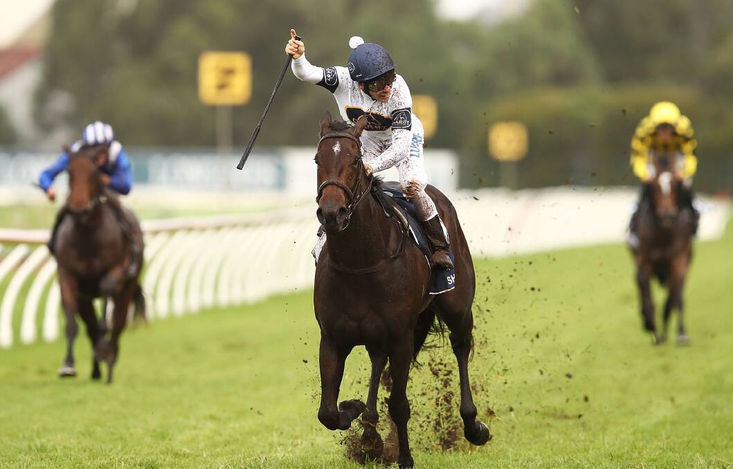 CHAMPION: Ben Melham celebrates after guiding She Will Reign to the $3.5 million Golden Slipper title on Saturday for former Orange trainer Gary Portelli. Photo: GETTY IMAGES