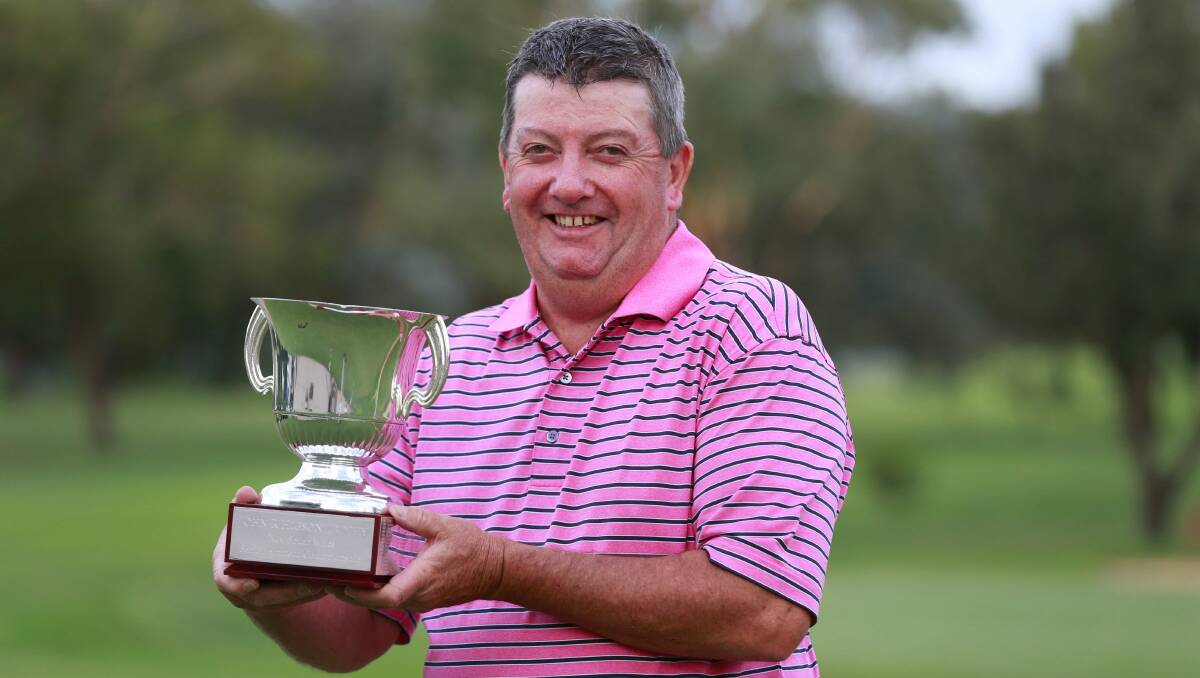 WHEN PAYNE PERSISTS: Robert Payne shows off his spoils from this week's NSW senior victory at Bathurst, his third state amatuer title. Photo: GOLF NSW