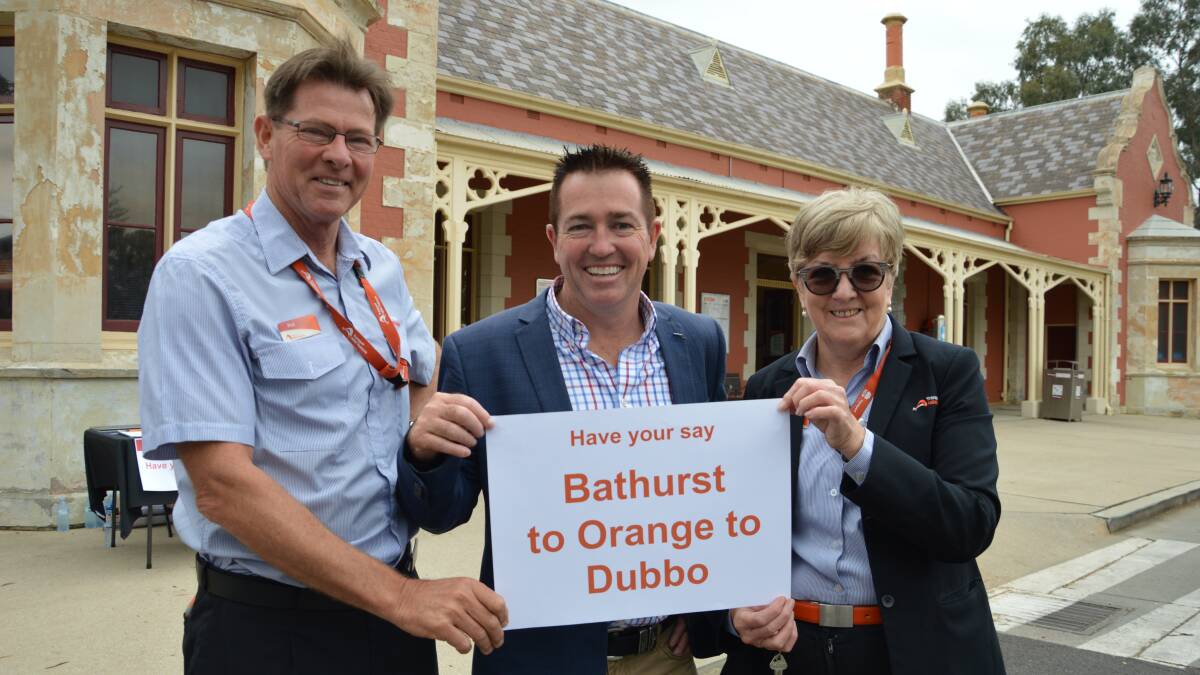 ALL ABOARD: NSW TrainLink will run a six-month trial of a morning coach service from Bathurst to Dubbo. Bathurst MP Paul Toole (centre) is pictured with Phil Baker and Janelle Bestwick from Bathurst railway station. Photo: SUPPLIED