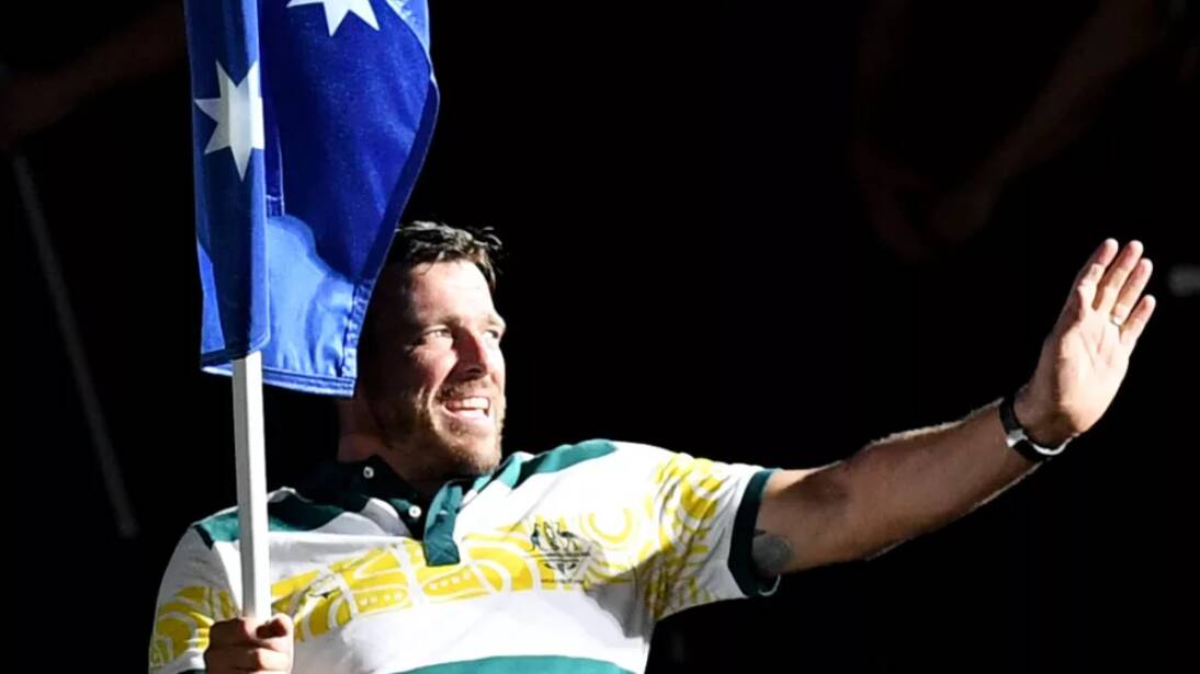 CHAMPION: Kurt Fearnley at the Commonwealth Games closing ceremony - an image fans watching at home in Bathurst did not get to see. Photo: AAP