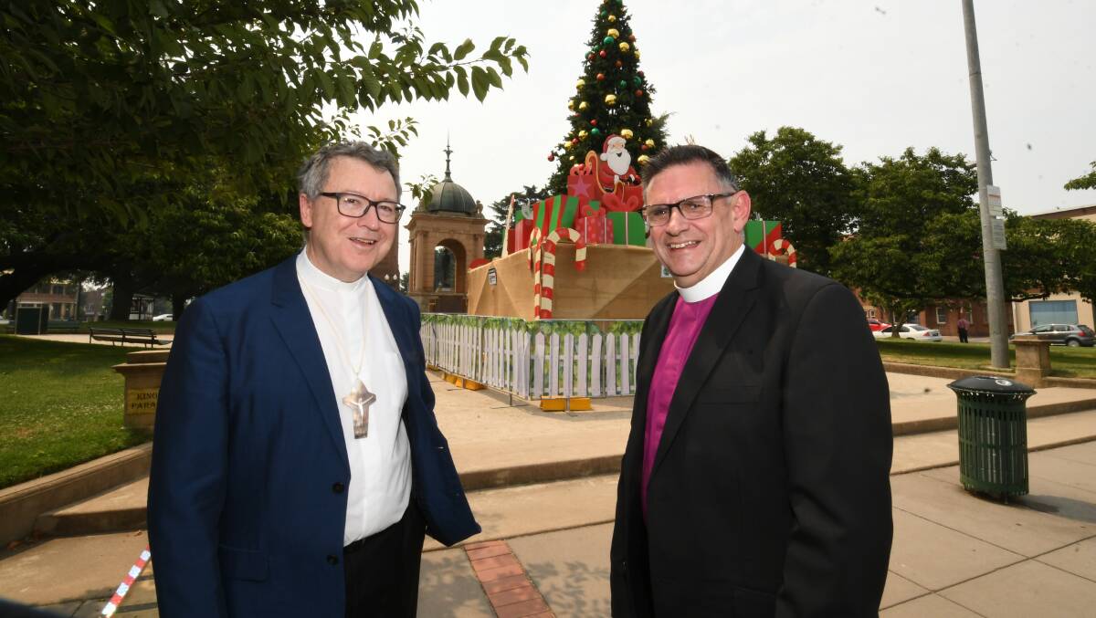 PEACE ON EARTH: Catholic Bishop Michael McKenna and Anglican Bishop Mark Calder have shared their Christmas wishes. Photo: CHRIS SEABROOK