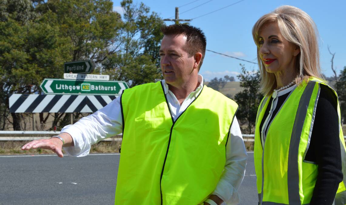 UPGRADE: Member for Bathurst Paul Toole inspects the Range Road turnoff on the Great Western Highway with Lithgow Councillor Maree Statham. Photo: SUPPLIED