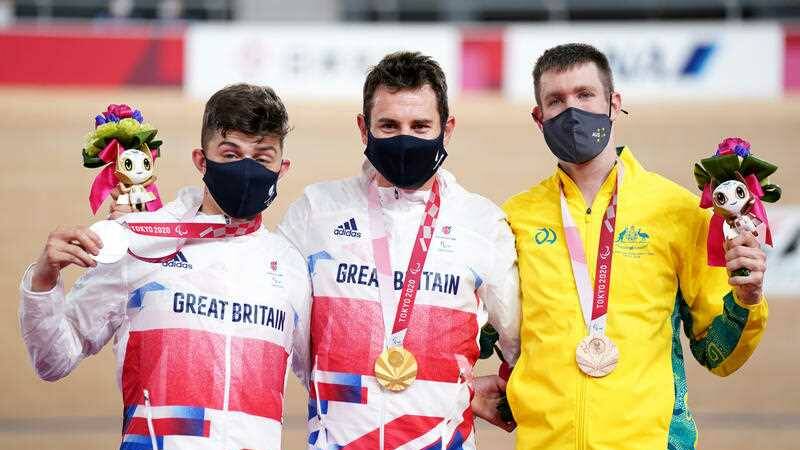 Great Britain's Jaco van Gass (centre) celebrates with his gold medal after winning the Men's C3 3000 metres alongside second placed Graham Finlay (left) with his silver medal and third placed Australia's David Nicholas with his bronze medal. Photo: Tim Goode, PA Media