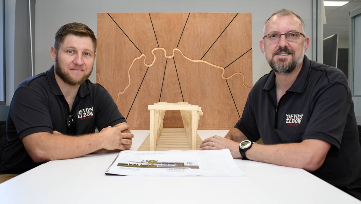 EXCITED: Devil's Elbow Brewery executive team members Adam Russo and Brendon O'Sullivan with plans for the new development. Photo: BELINDA SOOLE
