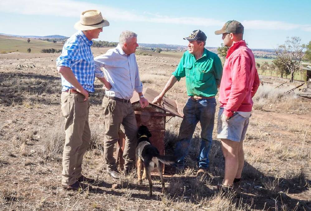 TALKS: Deputy Prime Minister Michael McCormack and Calare MP Andrew Gee met with Guerie farmers Greg and Matthew Wykes. Photo: CONTRIBUTED