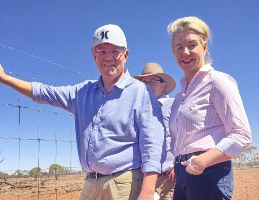 HEADWEAR: Cap-wearing Prime Minister Scott Morrison with the bare-headed Minister for Rural Health and Regional Communications, Bridget McKenzie at Quilpie, Qld, on Monday.