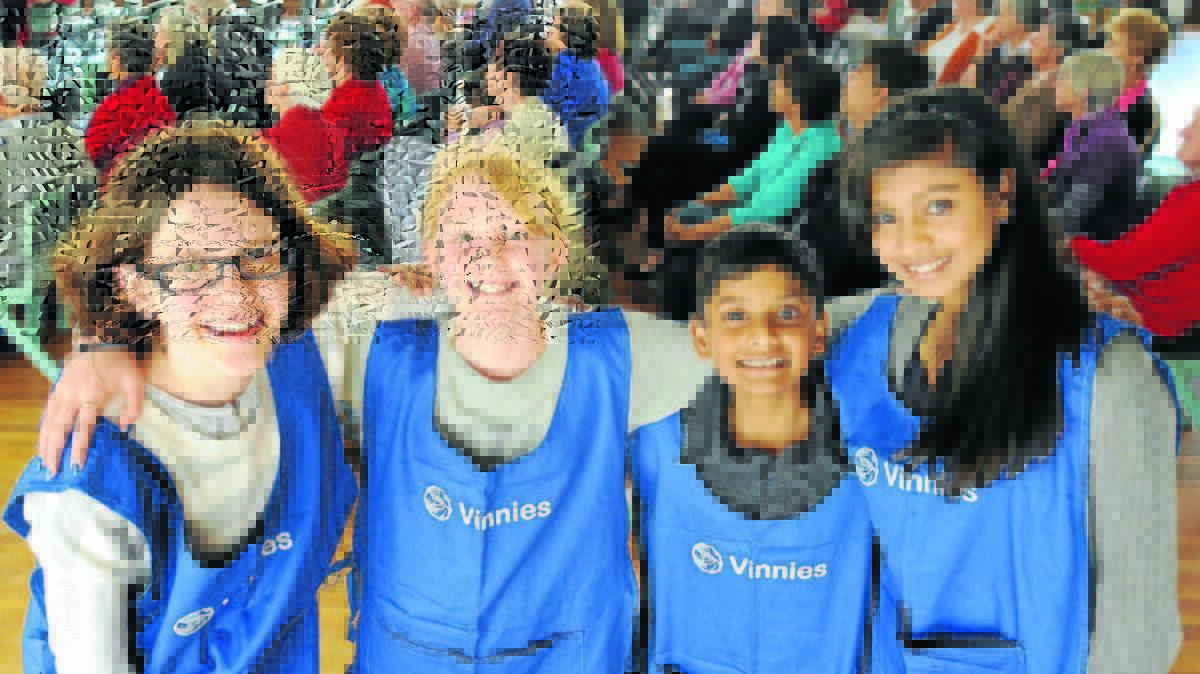  MINI VINNIES: St Vincent de Paul Society young volunteers Inez Russell, Bronte Lawrence, Rohan and Mira Praveen love helping other people. Photo: STEVE GOSCH 