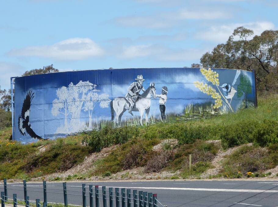 MOLONG STORY: The new mural on the Molong water tank depicts Thomas Mitchell and his guide, Yuranigh, and native flora and fauna. Photo: CONTRIBUTED