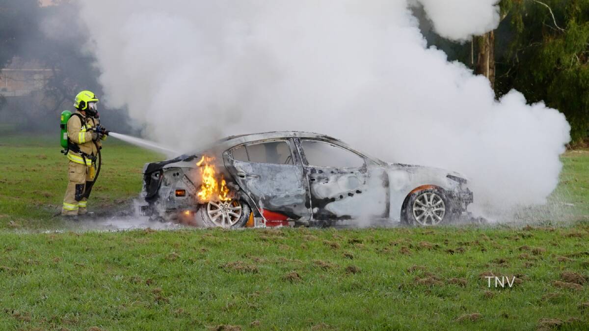 ARREST MADE: The red Mazda set alight in Orange on Tuesday morning. Photo: TROY PEARSON