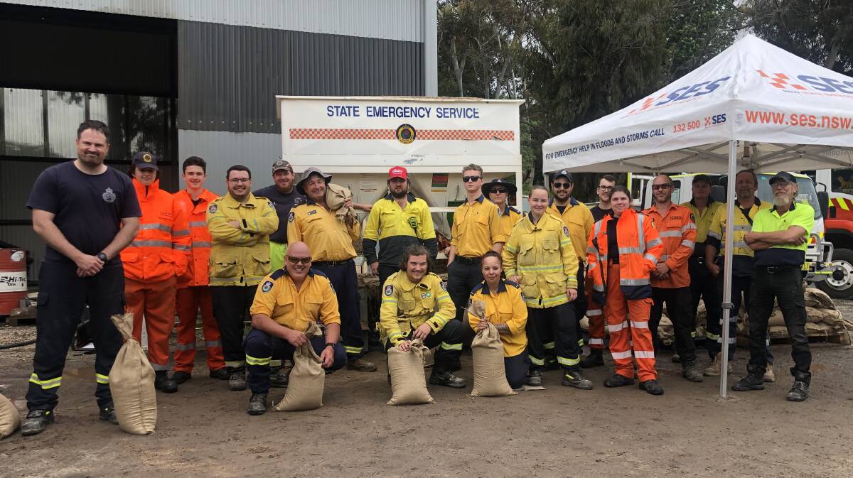TEAM WORK: Orange SES and local RFS members have been filling sandbags to go to areas under threat of flooding at Molong, Canowindra and Eugowra. Photo: Emily Gobourg.