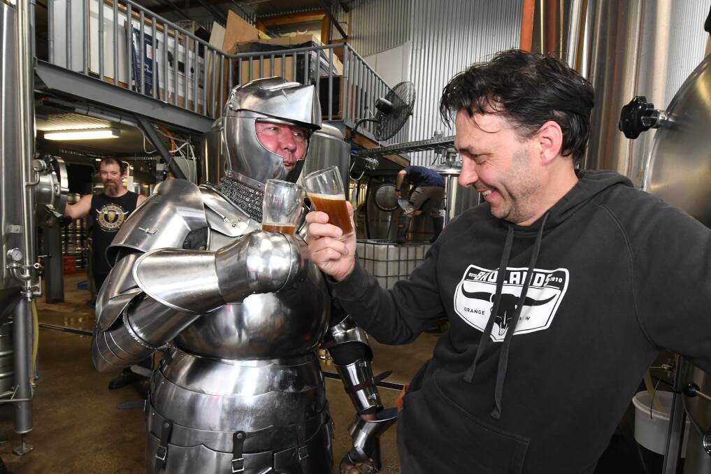 CHEERS: Medieval Faire organiser Andrew McKinnon raises a glass to the new 'old' ale with Badland Brewery's Jon Shiner. Photo: JUDE KEOGH