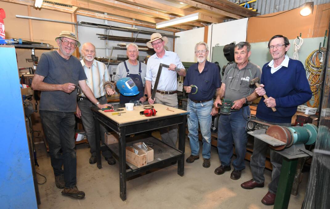 SHED BOOST: Federal Member for Calare Andrew Gee (centre) with Borenore-Nashdale Men's Shed members David Rahtz, David Schmidt, Peter Douglas, Max Davidson, John Douglas and Barry Jensen. Photo: JUDE KEOGH 
