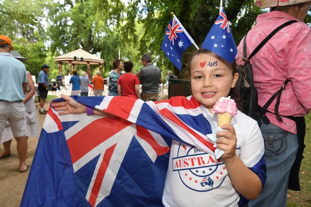 YOUNG AUSSIE: Allie Millikin enjoys an ice cream at last year's Australia Day festivities in Cook Park. Photo: JUDE KEOGH