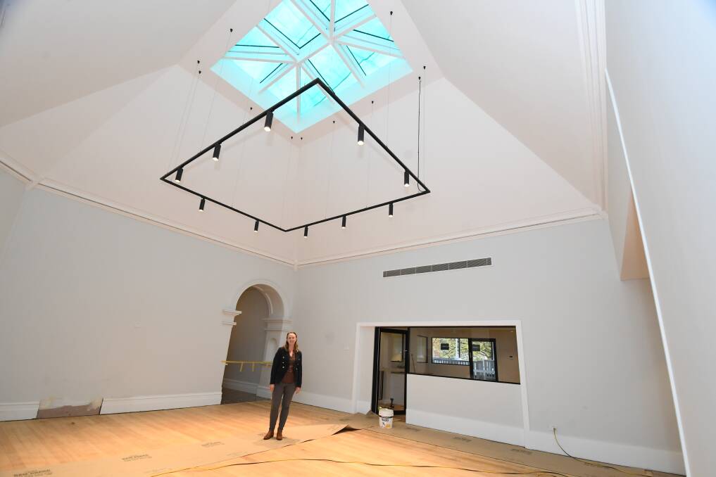 Ms Grabham under the impressive skylight in "the piazza" which will be the centre's dining area. Photo: JUDE KEOGH 