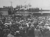 Crowds at the Orange railway station precinct on August 13, 1920, trying to catch a glimpse of their future King during his whirlwind 20 minute visit. Photo: ORANGE CITY LIBRARY COLLECTION