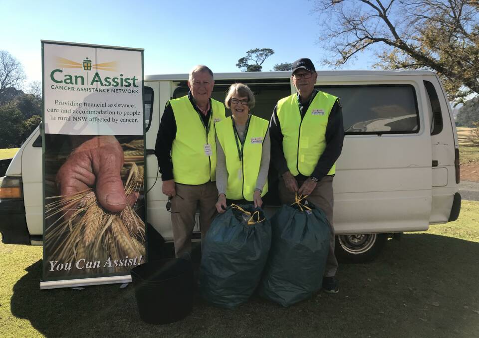 CAN-DO ATTITUDE: Can Assist Orange branch president Helen Corby with volunteers Paul Blunden and John Pierce and some of their collection. Photo: CONTRIBUTED.