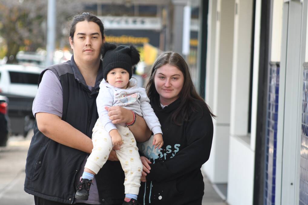 DEVASTATED: Tayla Winbank with her partner Dylan and daughter Bonnie. The family lost their puppy Luna on Monday. Photo: JUDE KEOGH