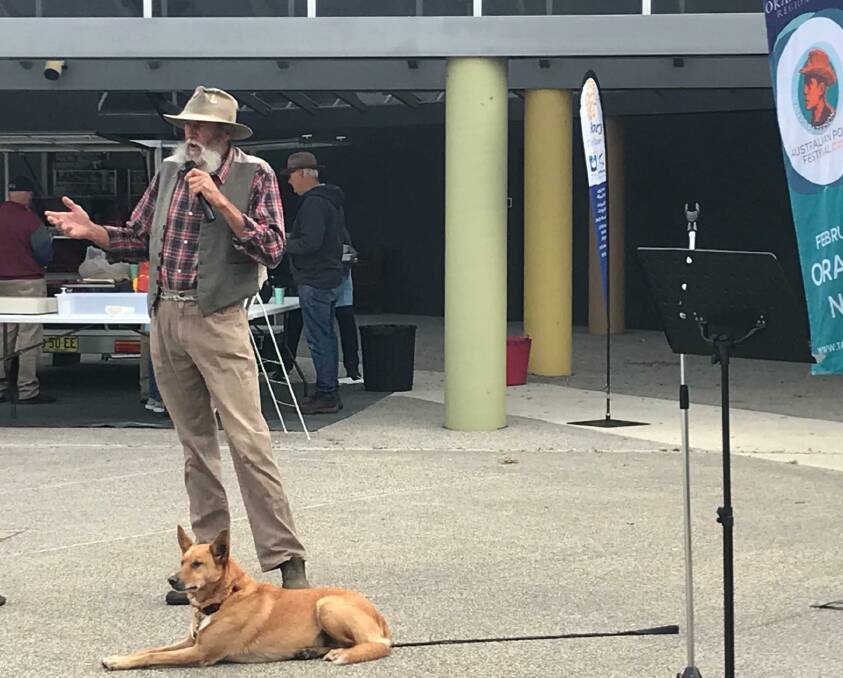 MORNING RECITAL: Bush poet Phil Inn with dog Millie at the Poetry and Brekky on the Pavers event at South Court this week. Photo: LEN BANKS