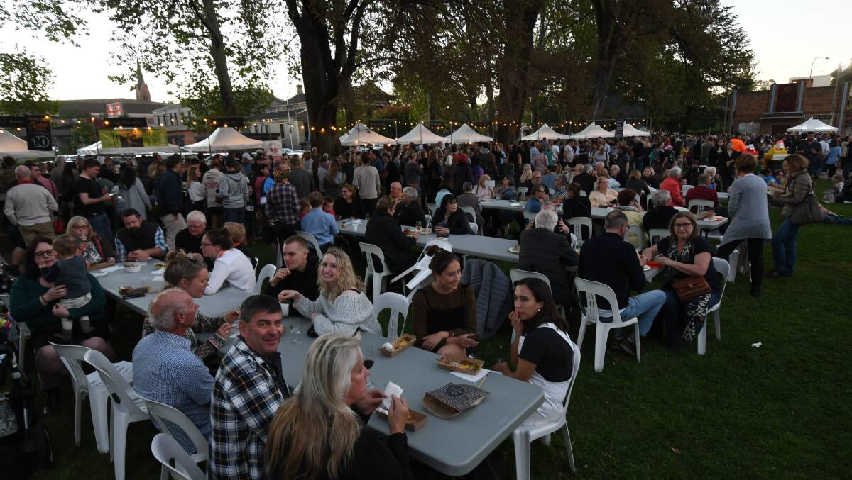 TUCK IN: Crowds in Robertson Park at the most recent FOOD Week in 2019, above.