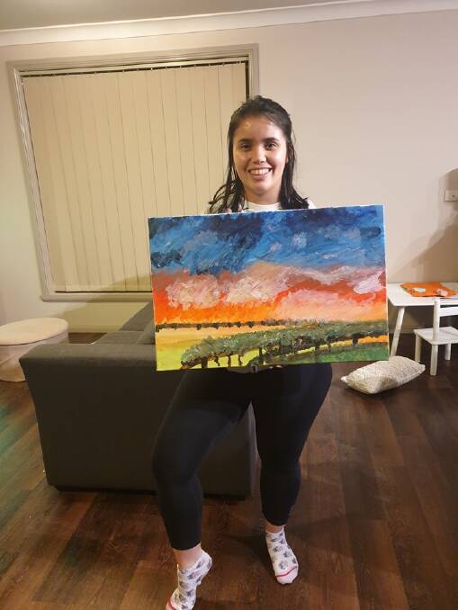 PROUD AS PUNCH: Gabrielle Tam with a painting she put together. Photo: SUPPLIED. 