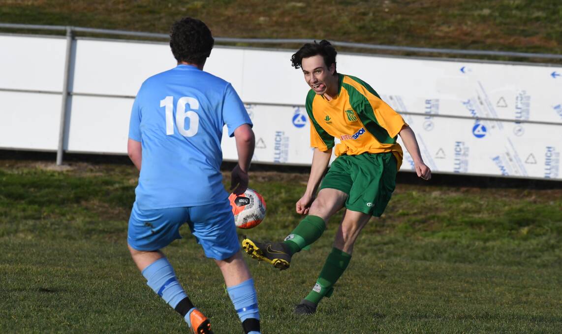 IN FORM: CYMS striker Will Bennett in action at Waratahs last weekend. He shone on Saturday for the green and golds as part of their 3-1 win over Millthorpe in wet and windy conditions. Photo: JUDE KEOGH