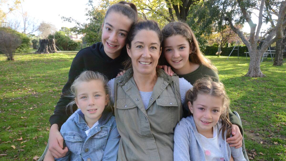 MOTHER'S DAUGHTERS: Elsie, Em and Lyla Callaway with (front) Frankie and Olive. Photo: JUDE KEOGH