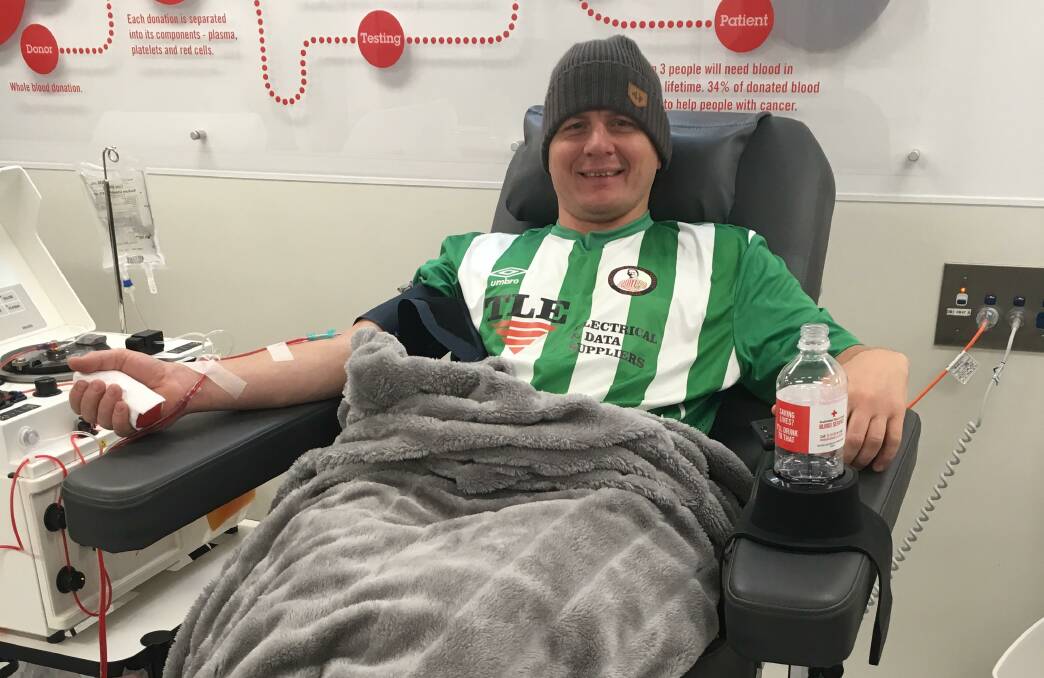 PHOTO CAPTION: Barnstoneworth United Football Club player Roland Gruneis donating as part of the Orange Soccer Clubs Blood Rivals Competition which ends on Friday October 18. Photo: SUPPLIED