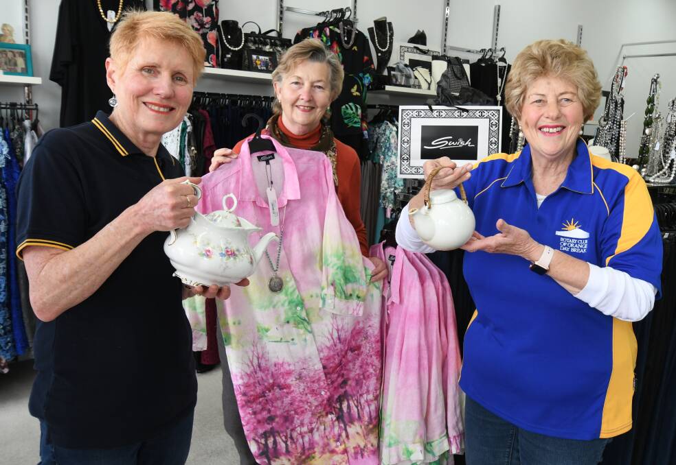 TEA AND FASHION: Joan Raftery, Christine Miller and Jill Everett at Swish Orange ahead of the event. Photo: JUDE KEOGH 1011jkrotary1