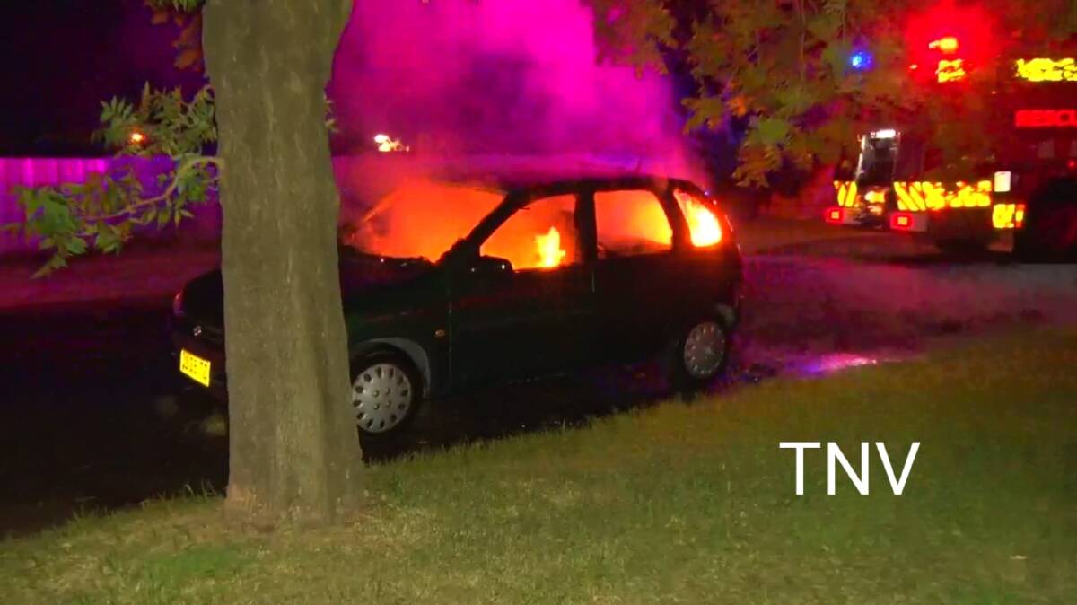 TORCHED: A familiar sight in Orange, this car was burned on Monday morning as one of three set aflame in the city. Photo: TROY PEARSON/TOP NOTCH VIDEO. 