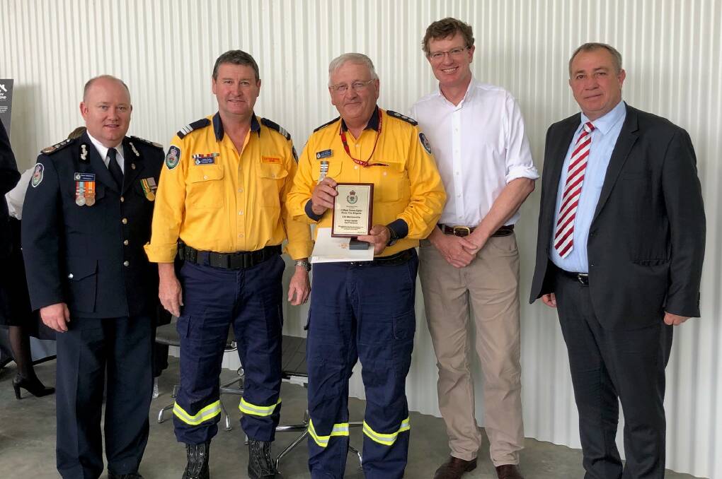 WELL DONE: NSW RFS commissioner Shane Fitzsimmons, RFS's John Eyles, member for Calare Andrew Gee and Orange deputy mayor Sam Romano presenting Geoff Selwood (centre) with an award for his 50 years of service. Photo: SUPPLIED 