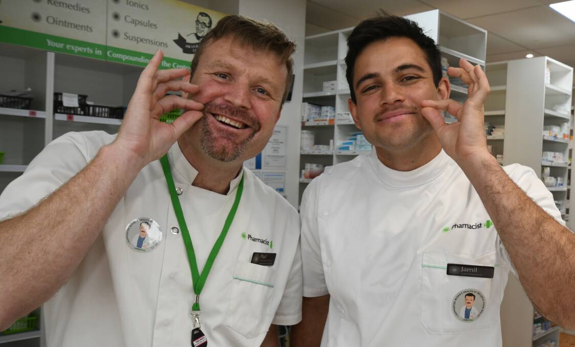 GROWING MO'S: McCarthy's pharmacists Paul Jones and Jamil Khalfan have been pushing for a bigger focus on men's health this month for Movember. Photo: JUDE KEOGH. 