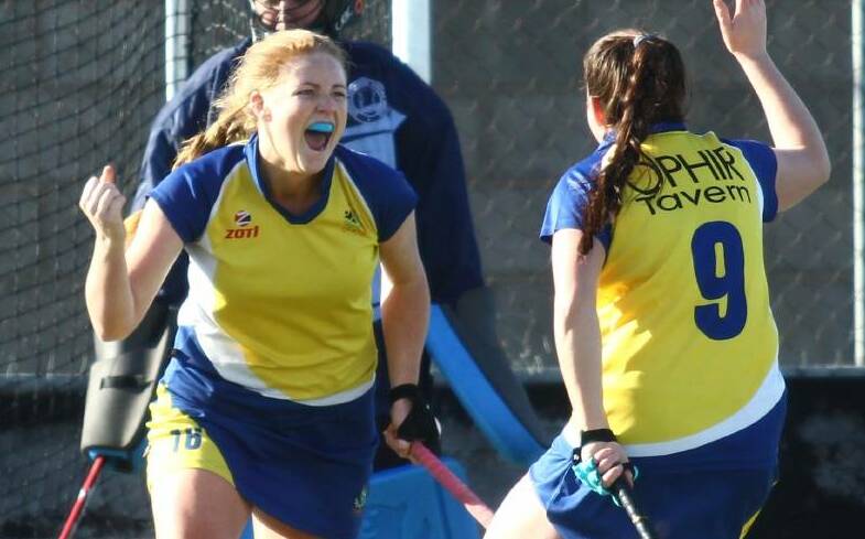 WE'RE BACK: Chloe Barrett celebrates finding the back of the net, her Ex-Services side's preparation for 2019 has been a good one. Photo: JUDE KEOGH