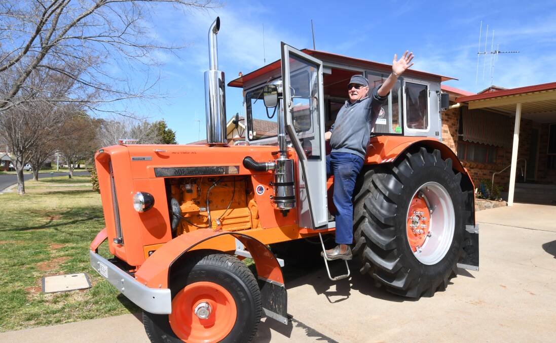 OFF WE GO: Orange tractor trek participant Graham Press with his 52-year-old Chamberlain 306 tractor. Photo: JUDE KEOGH 0913jktractor1
