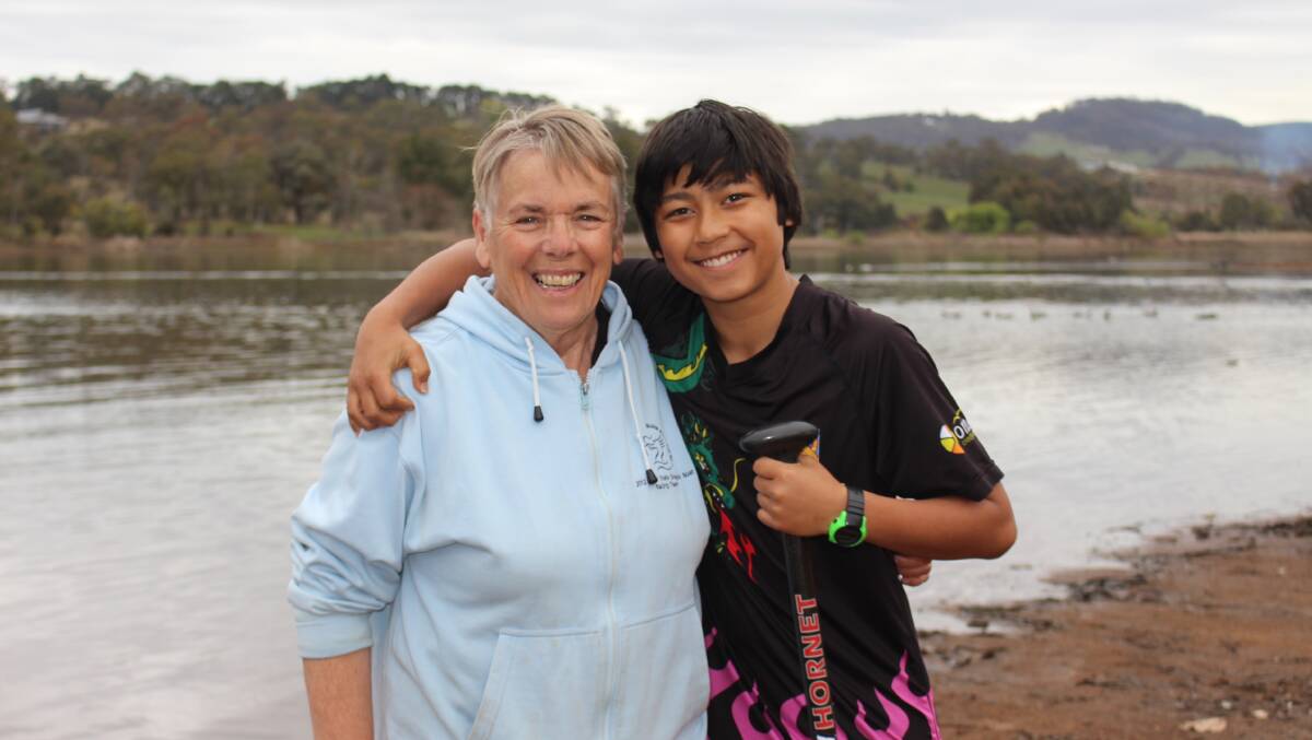 THUMBS UP: Isaac Sewak with trainer and coach Pearl Butcher on the shores of Lake Canobolas in 2018. Photo: MAX STAINKAMPH