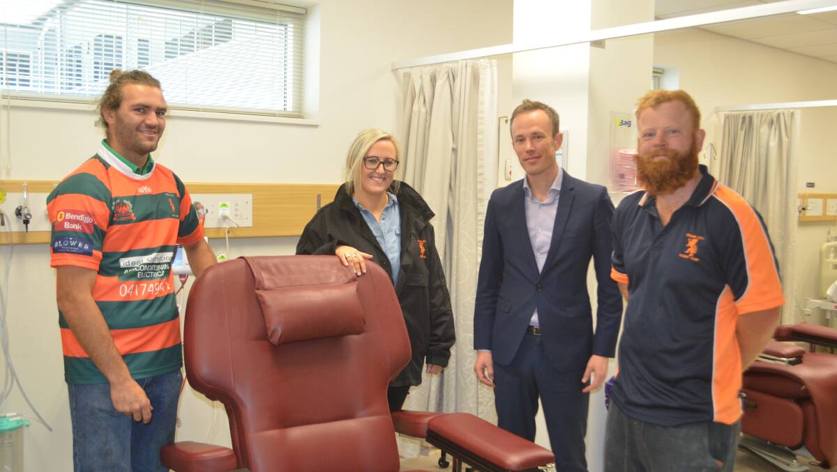 HELPING HANDS: Duncan Young, Tamara Grant, Peter Fox and Will Ryan in one of the hospital's oncology units. Photo: MAX STAINKAMPH
