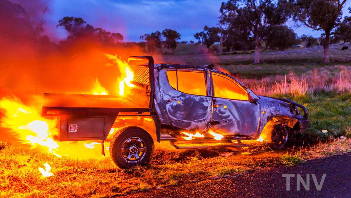 ABLAZE: A car which caught alight due to an engine malfunction on Thursday morning west of Orange. Photo: TROY PEARSON/Top Notch Video