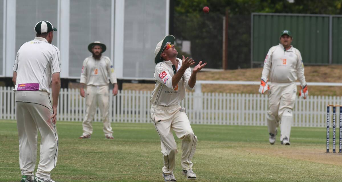 WELL TAKEN: Shaun Kirby watches the ball sail into his hands to complete an Ed Morrish wicket in the Warriors' top-of-the-table clash with CYMS. Photo: JUDE KEOGH.