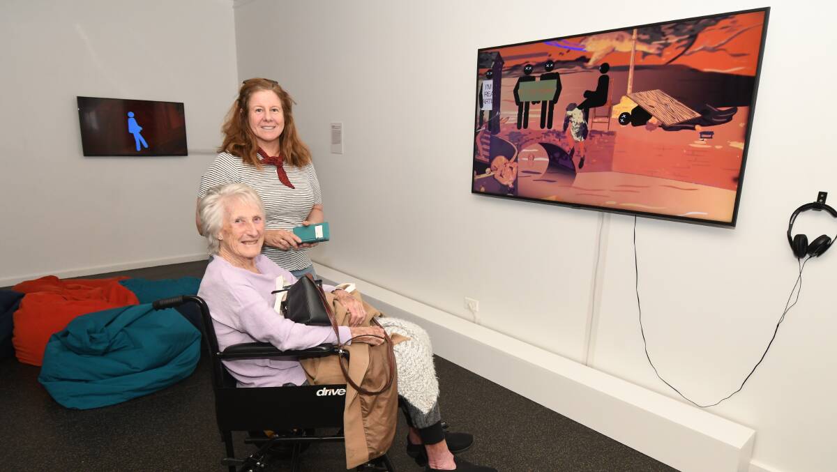 CHECKING IT OUT: Karen and Patricia Wilcox visiting the Orange Regional Gallery on Monday, watching one of the animations. Photo: JUDE KEOGH