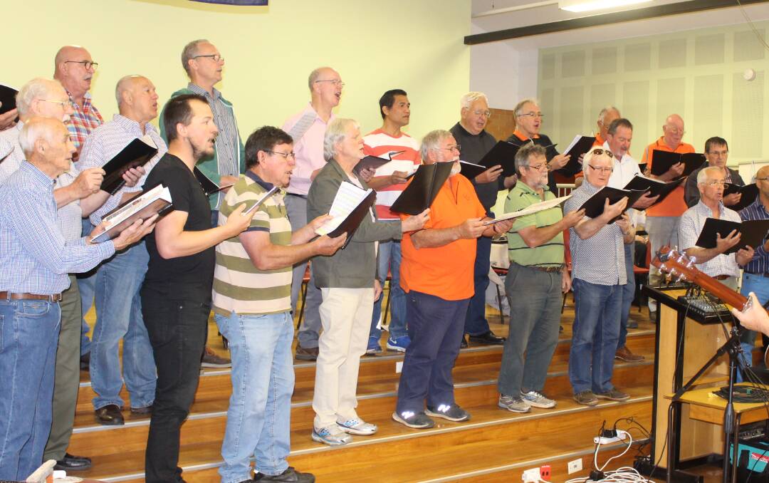 IN FULL SLIGHT: The male voice choir rehearsing for their shows on Friday. Photo: MAX STAINKAMPH