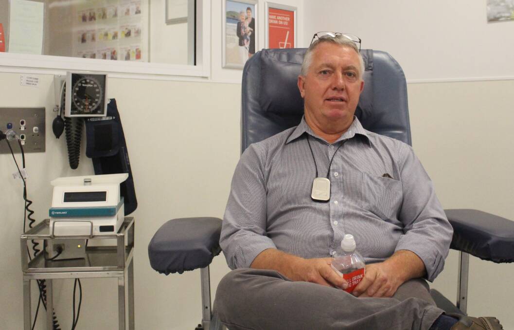 DONOR: Greg Delaney in the chair at the Red Cross Donor Centre on Kite Street. Photo: MAX STAINKAMPH 1212MSblood1