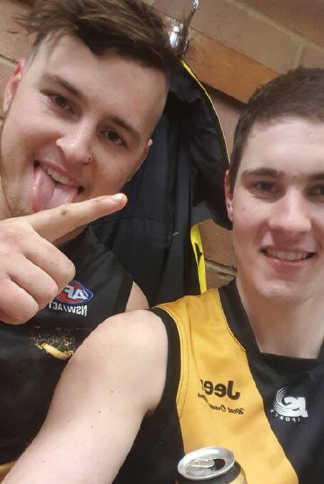 Hannus and Rothnie in the change rooms after the 2018 grand final. 