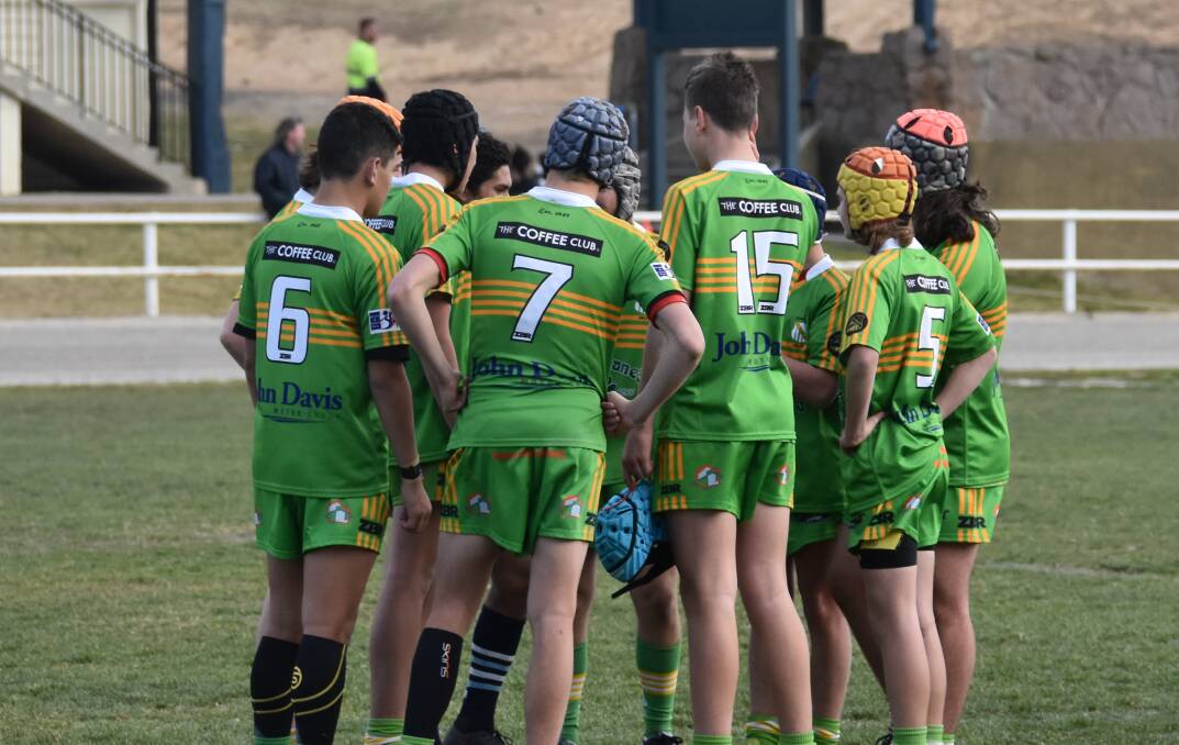 HUDDLE NO MORE?: Huddles and hi-fives may be banned and players restricted to one parent on the sidelines each when junior footy resumes. Photo: CIARA BASTOW