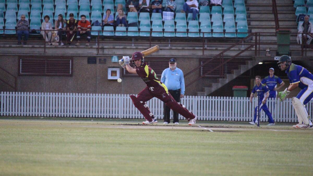 HIT AWAY: Charlie Greer knocks one out to extra cover at Wade Park on Friday night. Photo: MAX STAINKAMPH